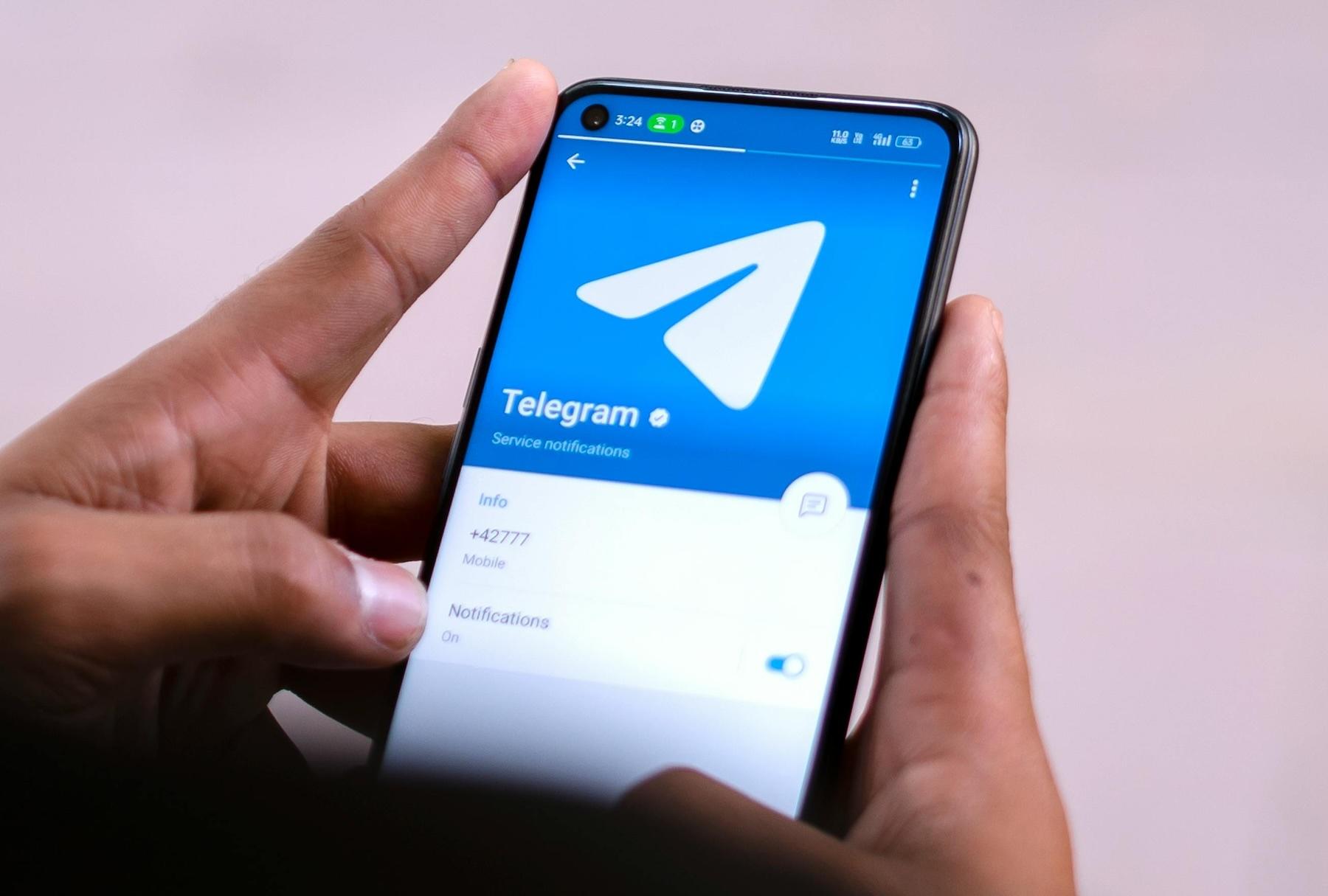 A photo of someone using Telegram.